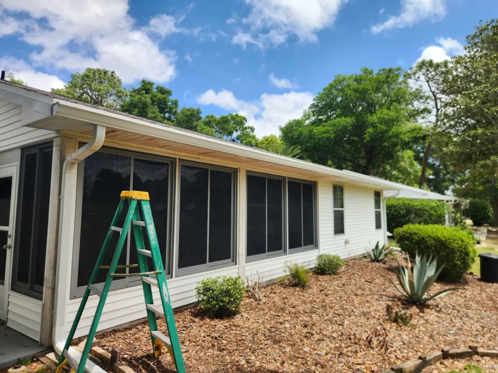 New white seamless gutter along the screened lanai of a Central Florida home