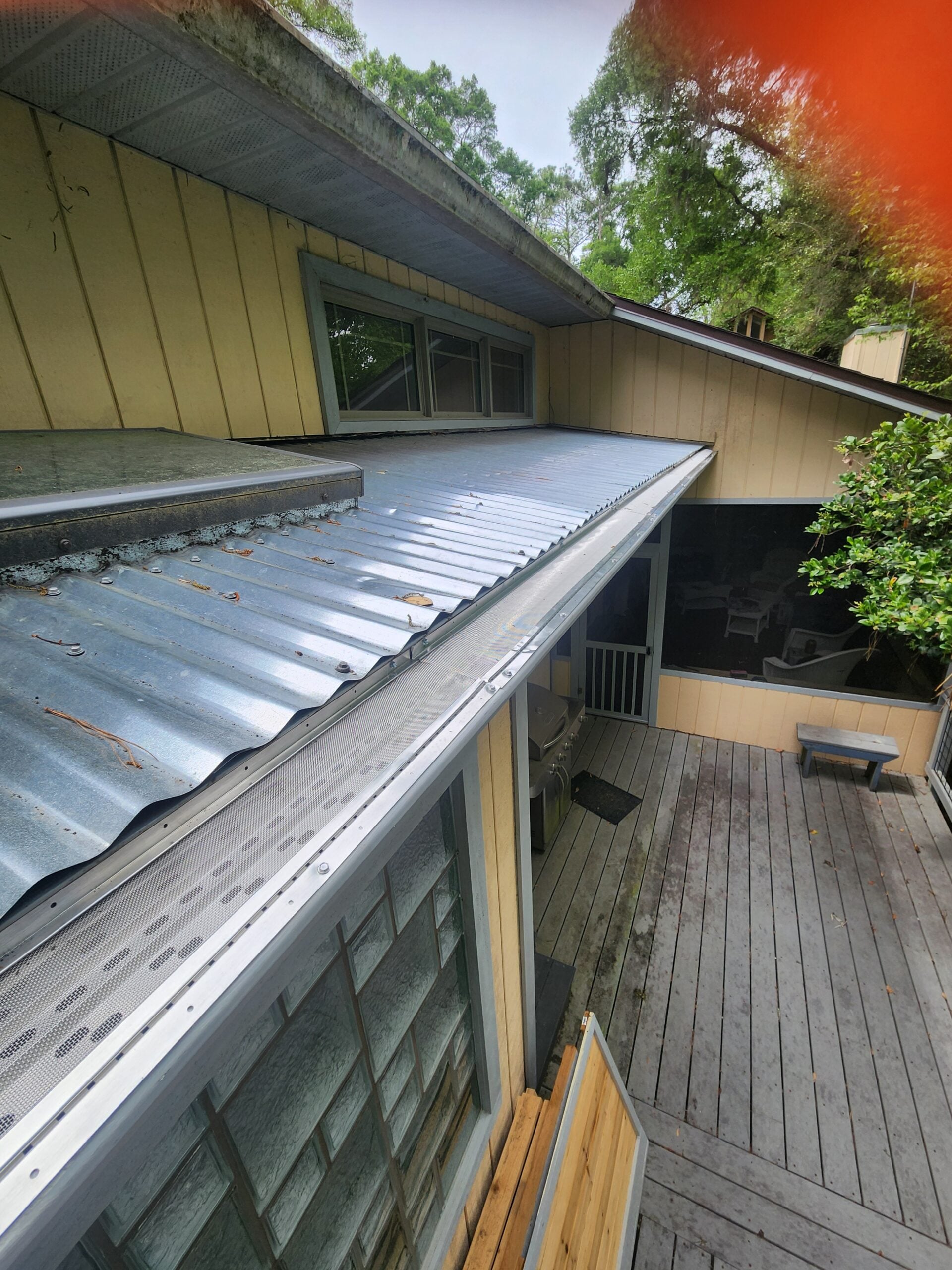 Close up of 316L stainless micro-mesh gutter guard installed by Premium Leaf Guards, showing the fine mesh that blocks leaves and pine needles
